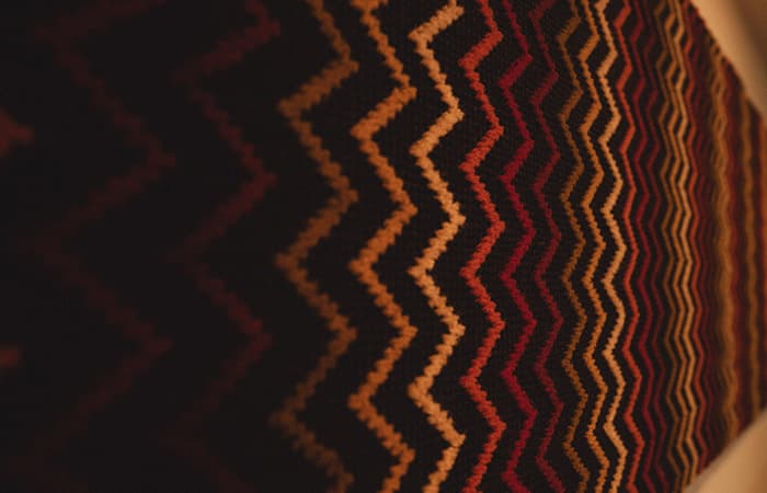 Close-up of a chevron-patterned carpet weave